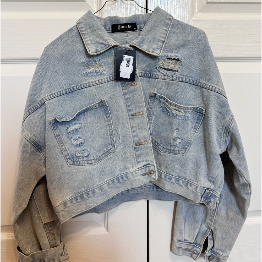 Denim jacket with rhinestone detailing on the back! NWT, bought from a boutique